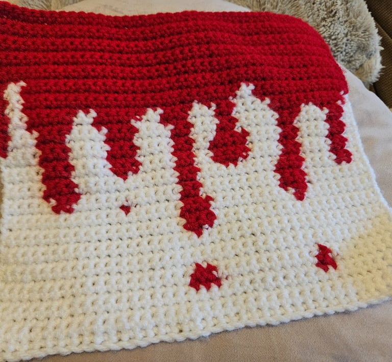a crochet tapestry of blood dripping