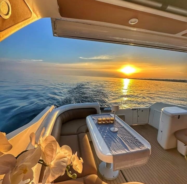 Elegant yacht seating area with sea view at sunset in Siracusa, Sicily