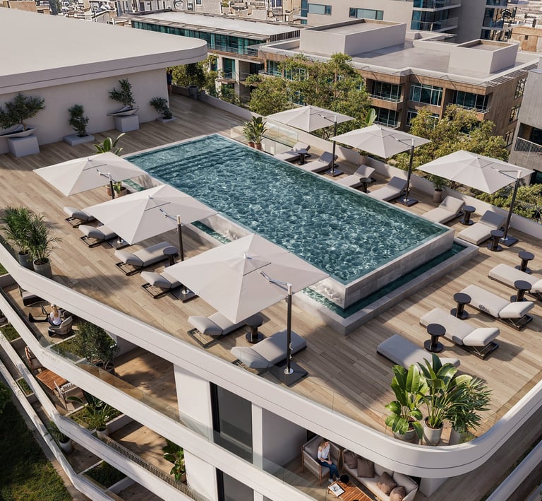 Luxury rooftop pool area with sunbeds and umbrellas at Lev Limassol, Cyprus