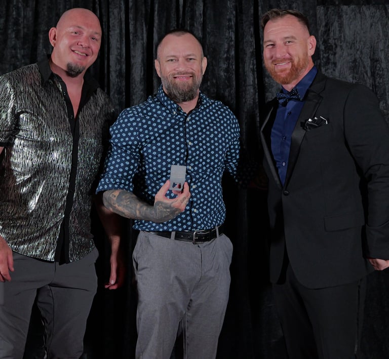 MMA coaches take a million view award for an athlete unable to attend International Podcast Awards