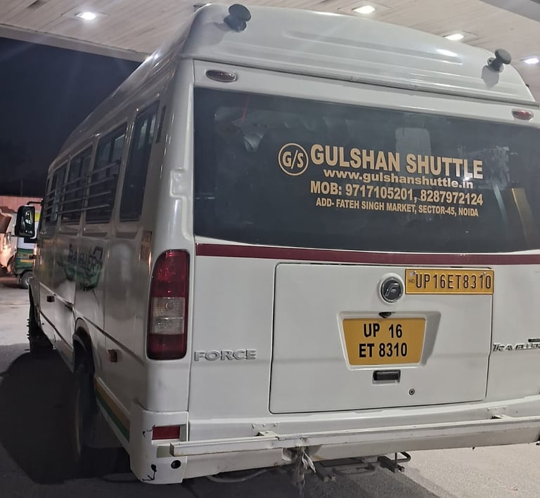 tempo traveller branded with gulshan shuttle transport service