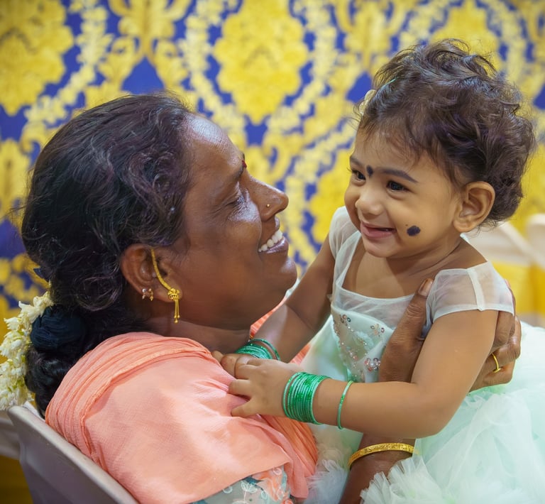 a woman holding a baby in her arms