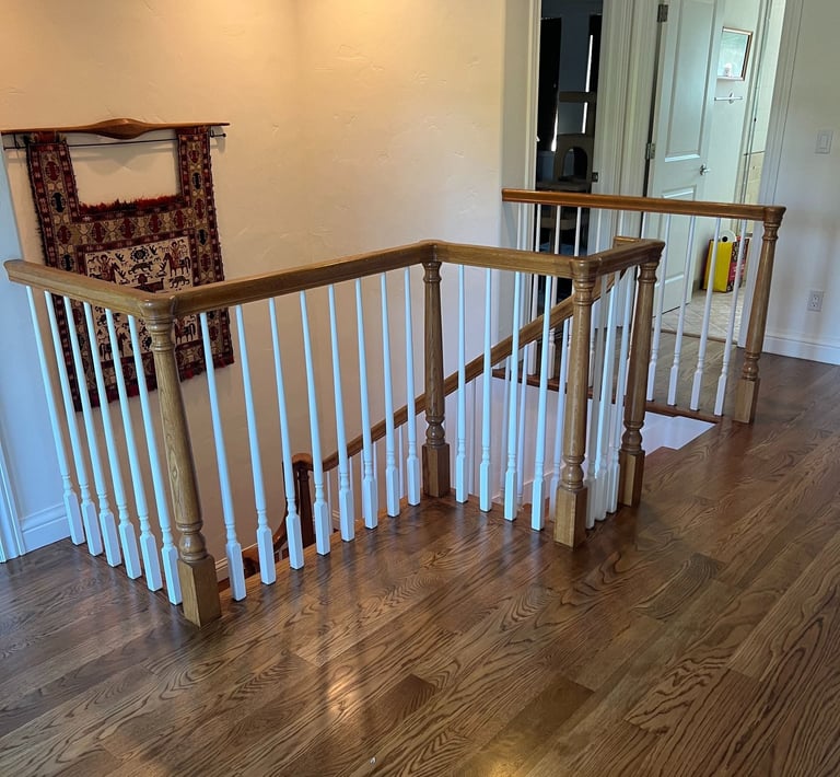a staircase way with a Hardwood floor and a stair case