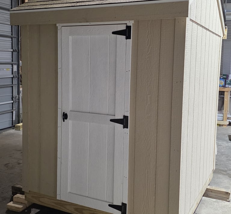 Custom 6x6 wooden shed built in Rhode Island, perfect for garden tools and small equipment.