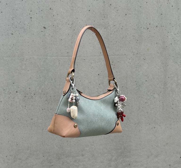 Elegant handbag featuring fun.arc.ik bag charms crafted from pearls and beads, women's accessories