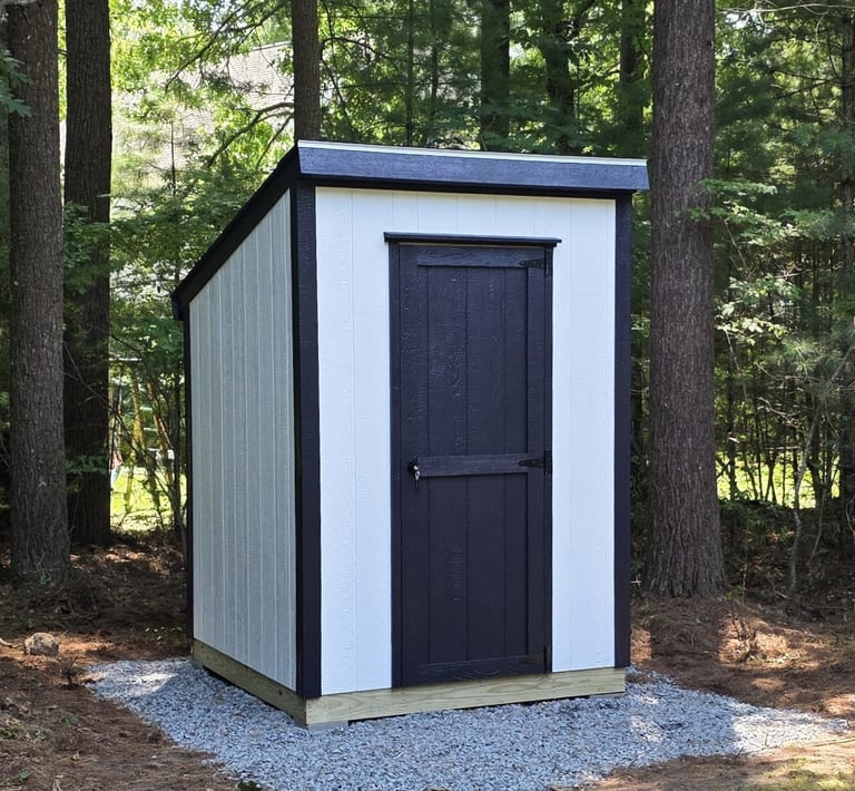 Compact 6x6 wooden storage shed with durable construction, ideal for small backyard spaces.