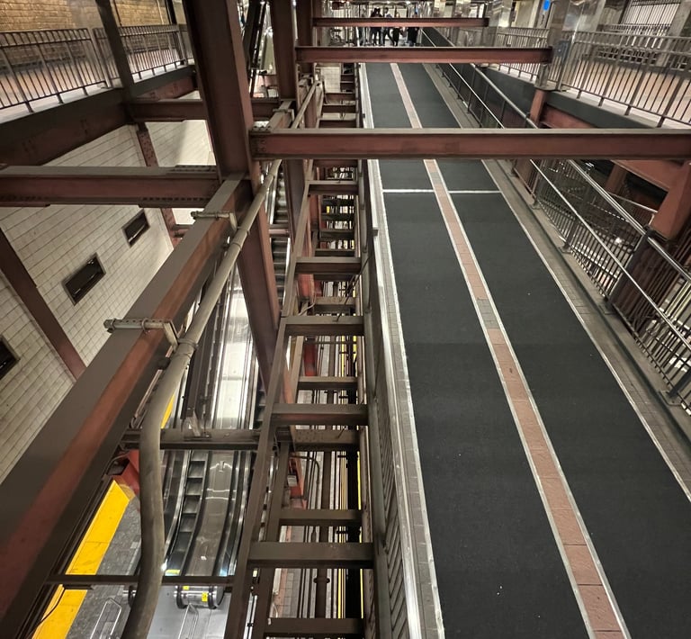 a train station with a train on the tracks