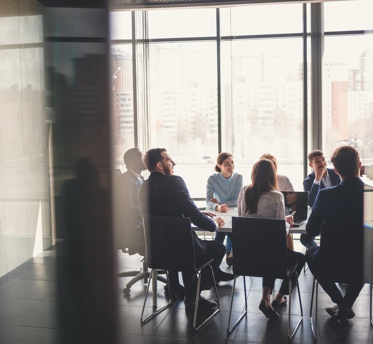 a group of people sitting around a table