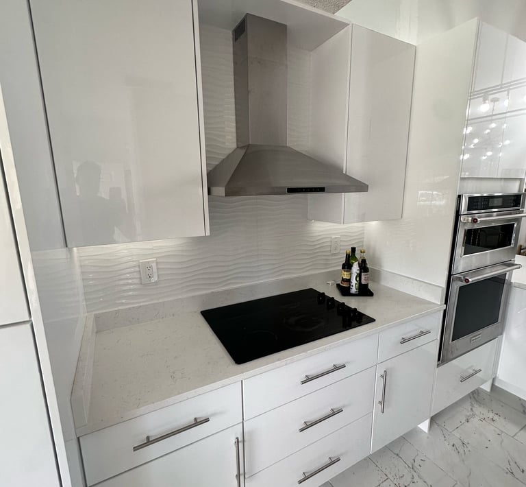 Before-and-after kitchen remodel showing wall removal and full layout redesign in Kissimmee resident