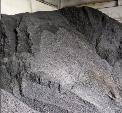 A large pile of fresh biochar
