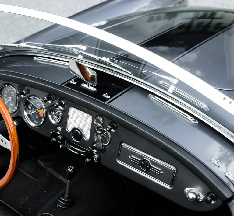 A close up view of the driver controls for a 1958 MG MGA Roadster.