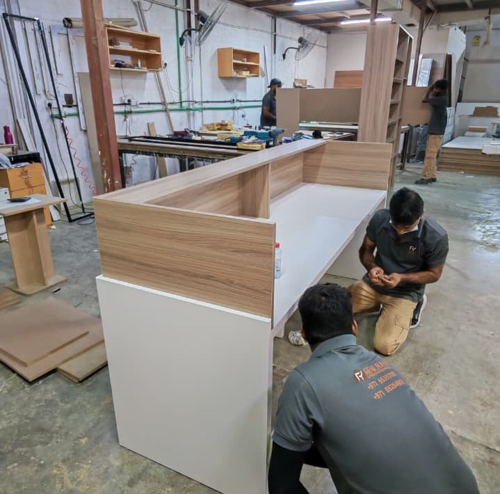 Custom made reception desk Dubai office furniture Royal Real Touch UAE