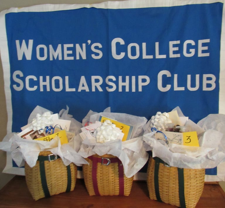 Women's college scholarship club sign with three pack basket raffle baskets