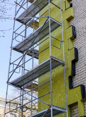 a tall building with a ladder and a ladder