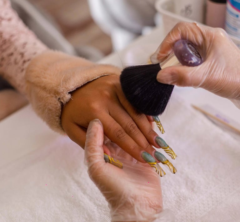 a person is getting their nails done by a manicure