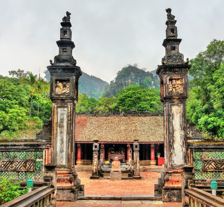 The historic Dinh Tien Hoang Temple in Hoa Lu Ninh Binh, featuring ancient stone pillars and a traditional Vietnamese