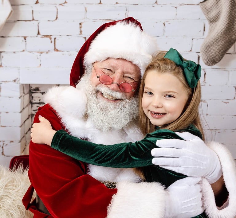 Sabta Jay giving a girl a hug.