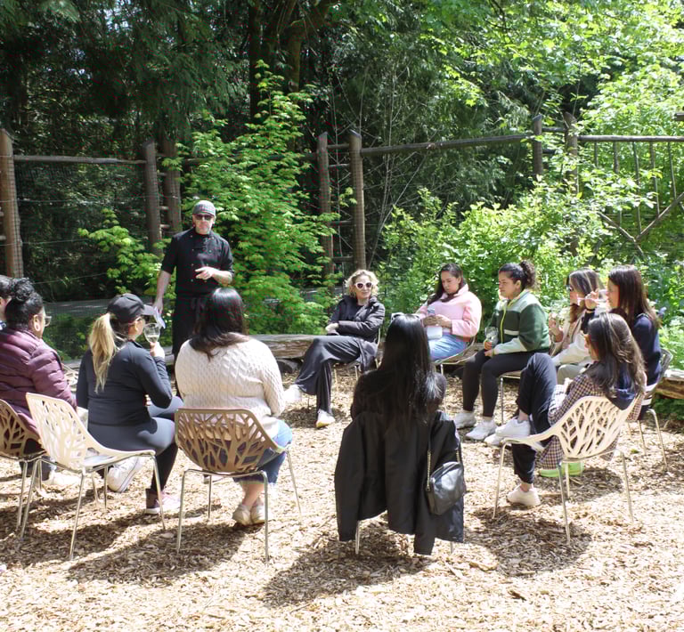 Seattle corporate team having a wine tasting in the sunshine during their retreat