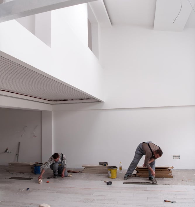 handymen performing maintenance and repair work inside a commercial Auckland property