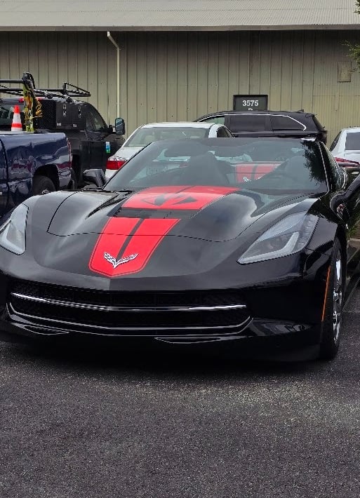 Black Corvette Stingray with red racing stripe installed in Livermore, California.