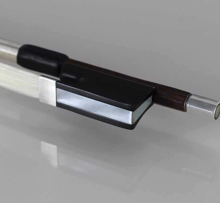 Fresh rehair for W.E. Hill & Sons violin bow