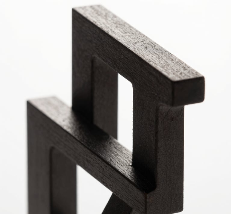 Abstract high-contrast 3D geometric structure, sharp metallic edges, dark charcoal and pure white lighting, studio background, macro shot, clean minimalist composition
