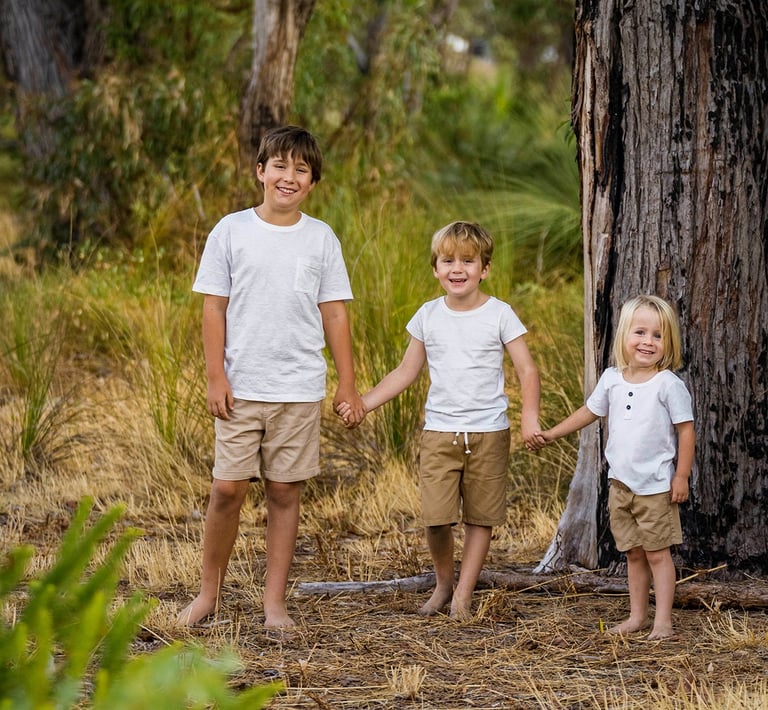 Three brothers standing in Perth bushland landscape, children's family photography by Fisher Photography