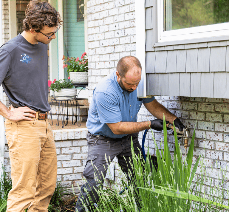 Clint Smith (Owner) Performing a pest control prevention operation