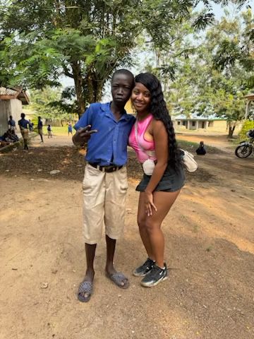 Pathway2purposeglobal vice president with a student from the village of denkyira 