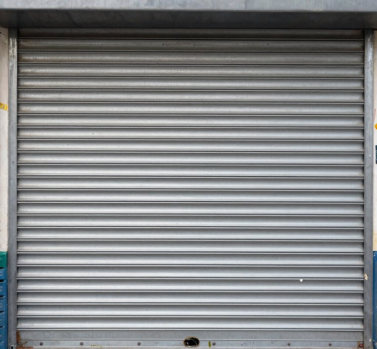 A close-up of various types of window shutters displayed in a workshop.