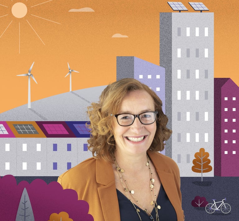 Women sits in front of an illustrated scene of colourful a town with hills and wind turbines.