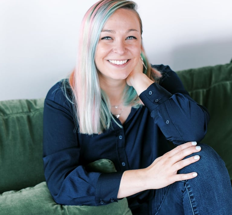 Tabitha with butterfly effect consulting on a couch