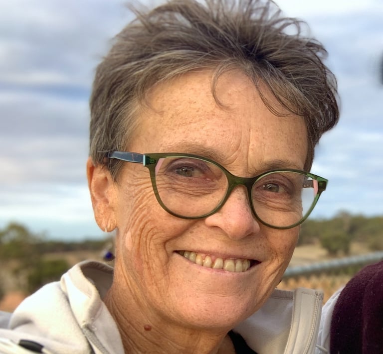 Face of smiling woman wearing glasses