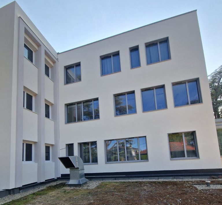 a building with a large window and a sculpture of a sculpture