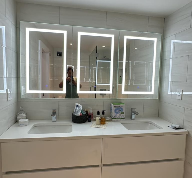 a bathroom with a mirror and a mirror