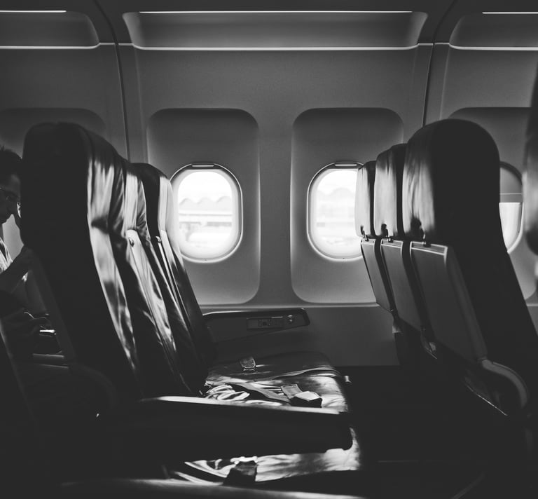 grayscale photo of airplane seats