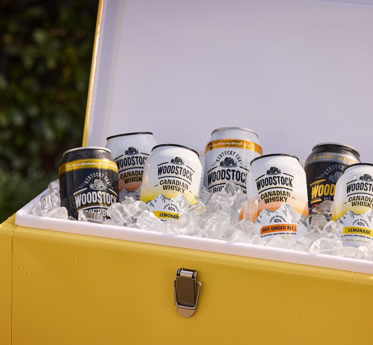 Product photography - a cooler box with cans of woodstock whisky