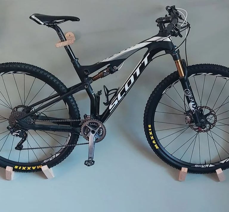 A bicycle mounted on the wall so that it is aesthetically pleasing and can be easily accessed