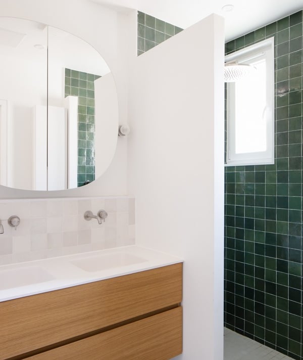 a bathroom with a mirror and a mirror