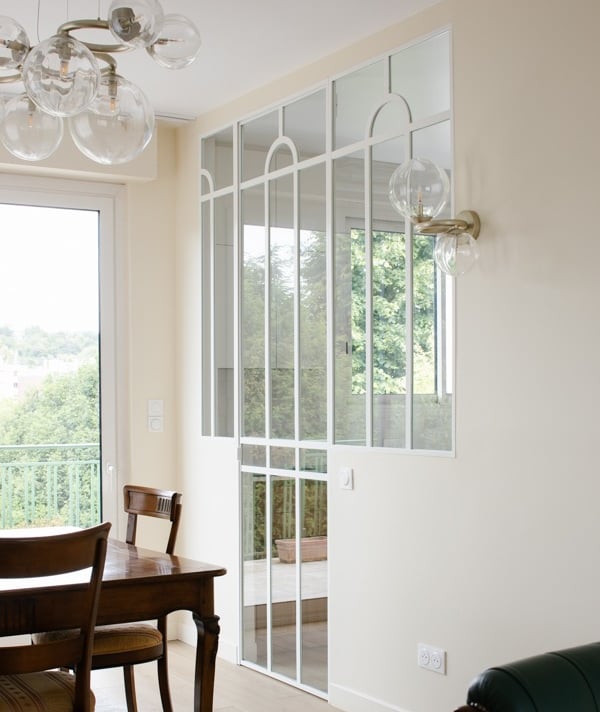 a dining room with a table and chairs