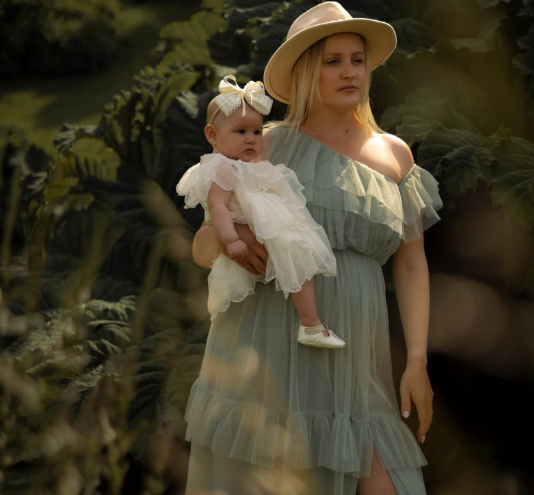 Mother holding her baby during a natural outdoor family photoshoot in Brighton and Hove.