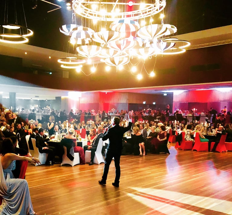 A wide-angle view of a record-breaking fundraising gala managed by Craig Rosie in a Los Angeles ball