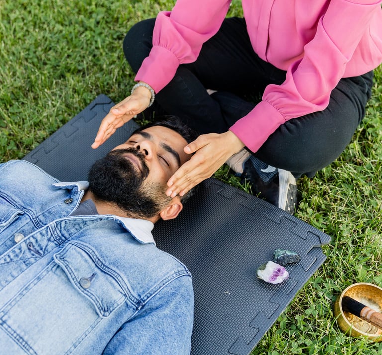 A woman doing a reiki session in the park