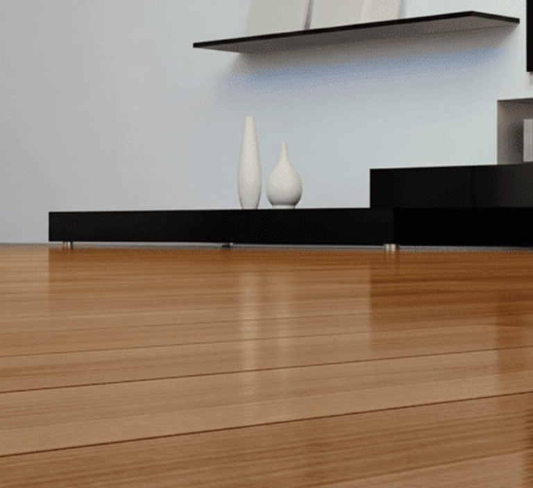 Polished high-gloss hardwood flooring in a modern living room with minimalist furniture.