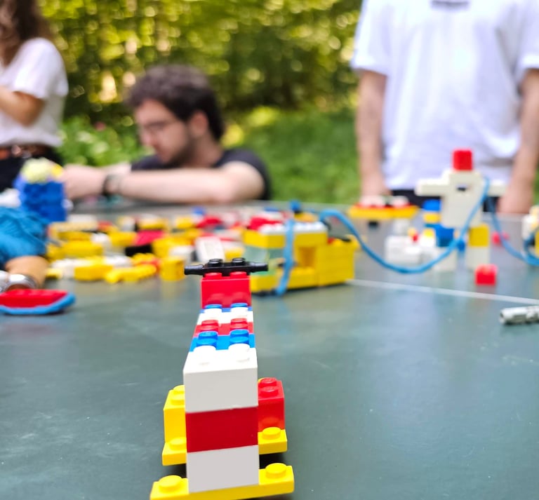 a group of people playing with legos