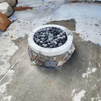 Natural stone gas firepit