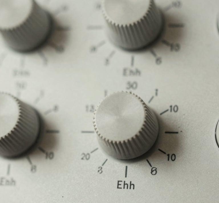 Close-up macro shot of high-end analog audio dials, soft diffused lighting, precise mathematical typography on the dials, muted slate tones, 35mm film.