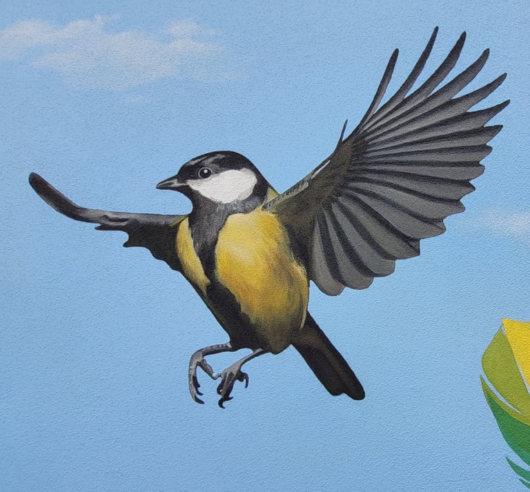 Détail de la peinture d'une fresque murale: une mésange prend son envol. Viry, Jura, 39.