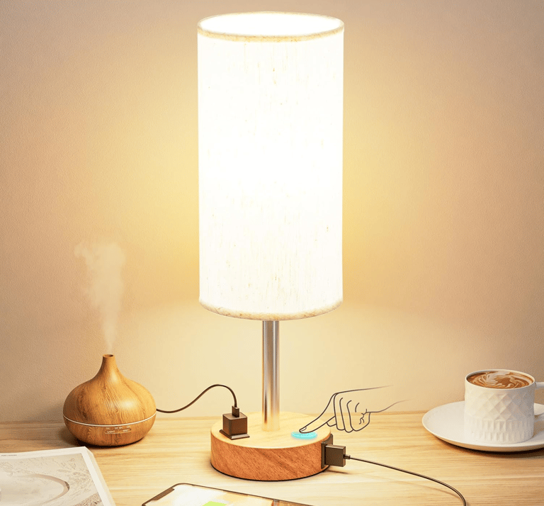Fenmzee Bedside Table Lamp on a wooden nightstand with soft light.