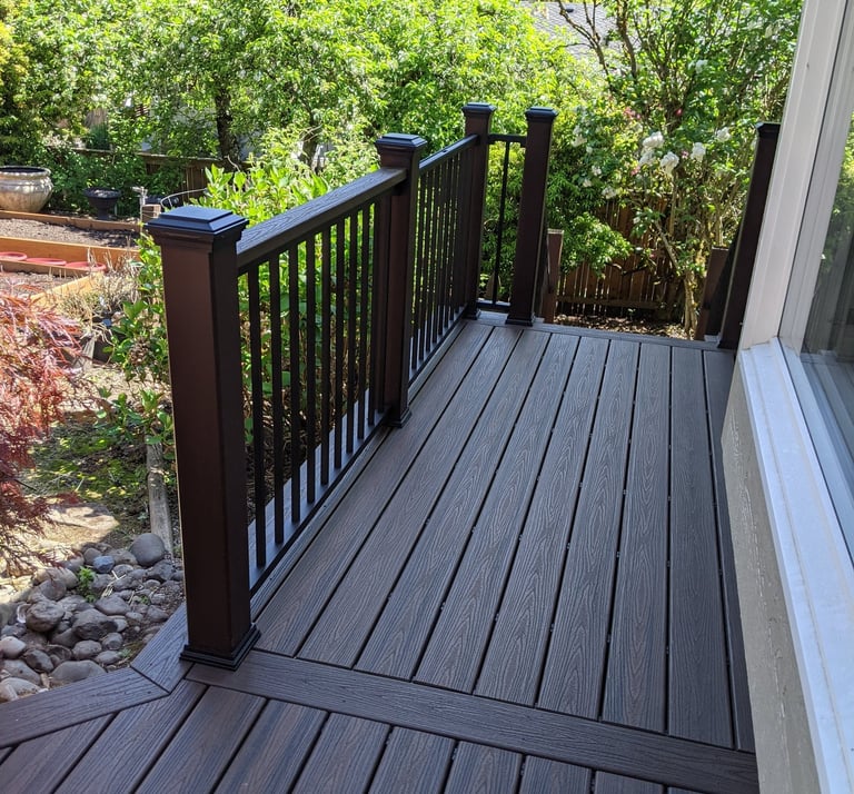 Composite decking with composite handrail